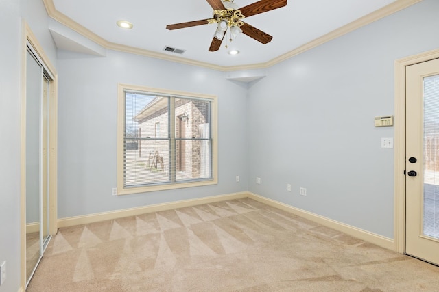 unfurnished room featuring baseboards, visible vents, light colored carpet, ornamental molding, and recessed lighting