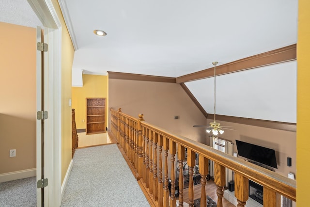 corridor featuring lofted ceiling with beams, carpet floors, visible vents, and baseboards