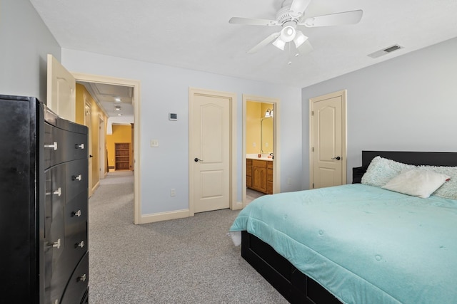 bedroom featuring visible vents, attic access, light carpet, ceiling fan, and baseboards