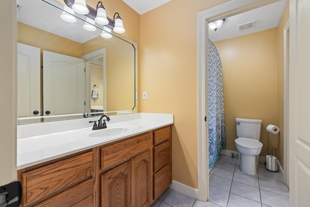 full bath with tile patterned flooring, toilet, vanity, visible vents, and baseboards