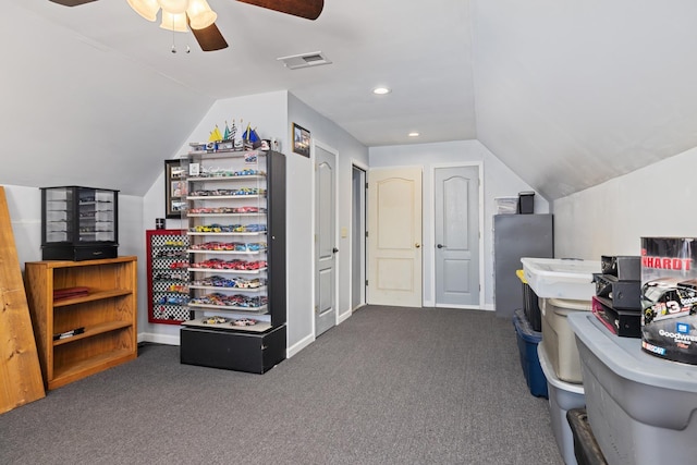 carpeted office space featuring recessed lighting, visible vents, vaulted ceiling, ceiling fan, and baseboards