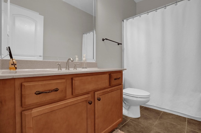 full bath featuring toilet, curtained shower, vanity, and tile patterned floors