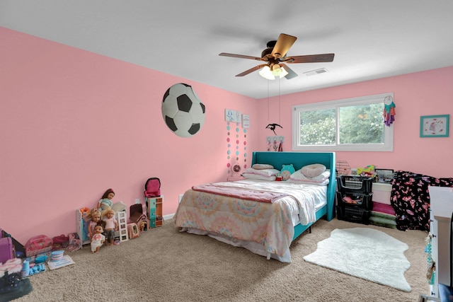 bedroom with ceiling fan, visible vents, and carpet flooring