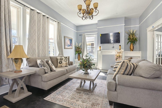 living room with a textured ceiling and an inviting chandelier