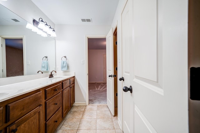 full bathroom featuring tile patterned flooring, visible vents, a sink, and double vanity