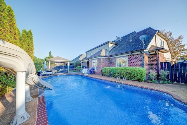 view of pool featuring a gazebo, fence, and a fenced in pool