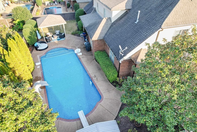 outdoor pool with a patio area