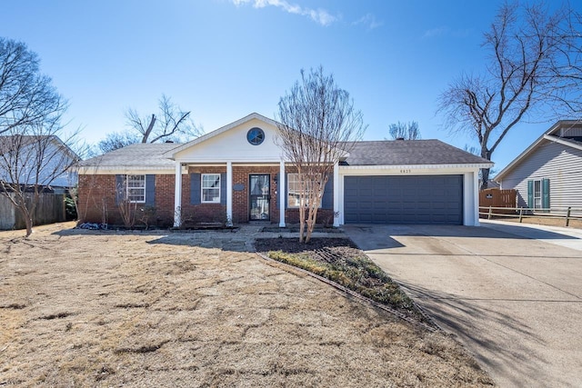 ranch-style home featuring brick siding, driveway, an attached garage, and fence