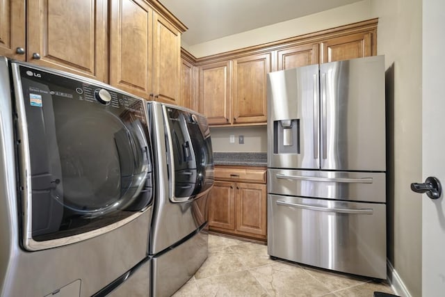 clothes washing area featuring independent washer and dryer