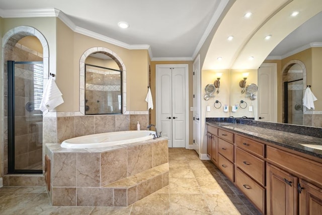 full bath featuring ornamental molding, a garden tub, and a shower stall