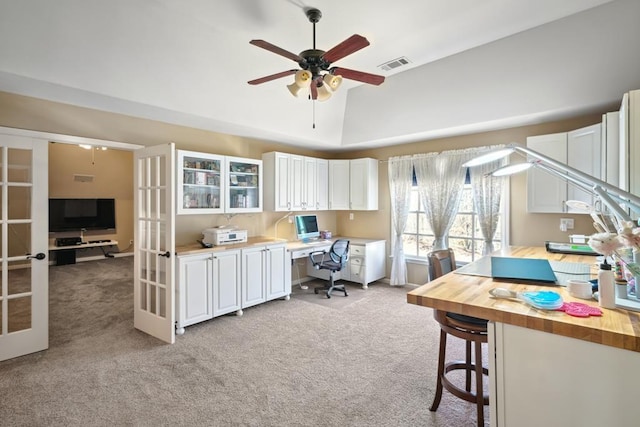 office area with french doors, visible vents, and light colored carpet