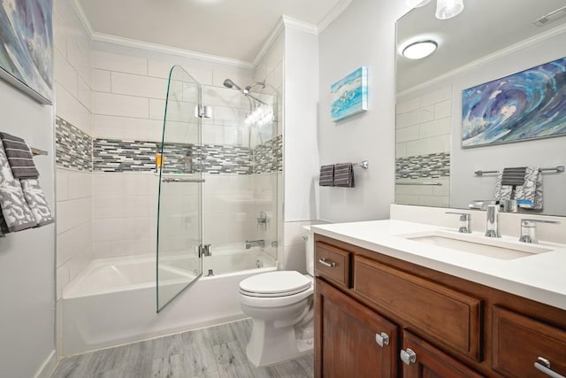 full bath featuring crown molding, visible vents, shower / bathing tub combination, toilet, and vanity