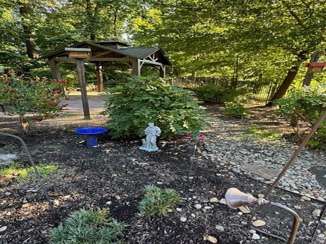 view of yard with fence and a gazebo