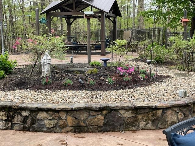 view of yard with fence and a gazebo