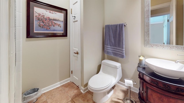 full bathroom with tile patterned floors, vanity, toilet, and baseboards