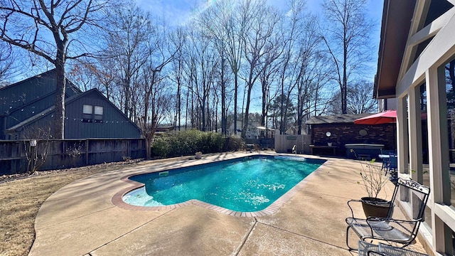 view of pool with a fenced in pool, a fenced backyard, and a patio