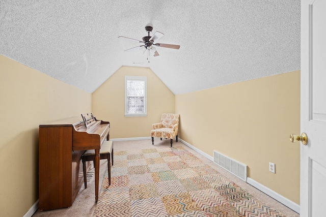 additional living space with baseboards, visible vents, vaulted ceiling, a textured ceiling, and carpet floors