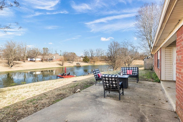 view of patio / terrace with outdoor lounge area and a water view