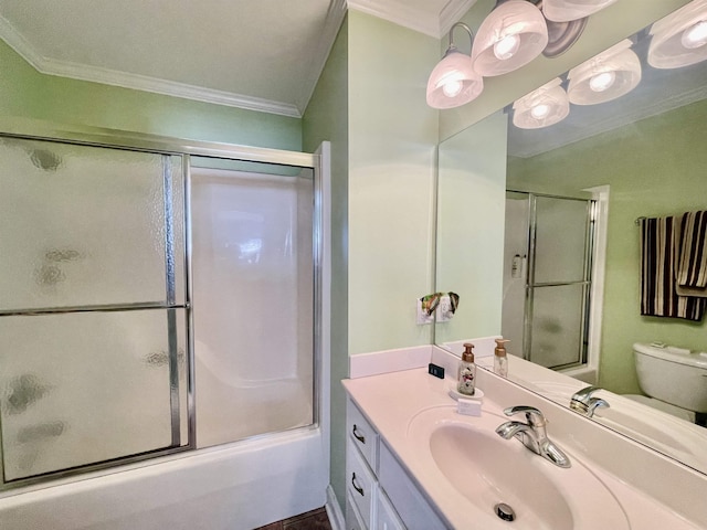 bathroom featuring toilet, shower / bath combination with glass door, ornamental molding, and vanity