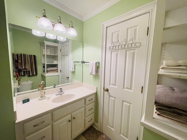 bathroom featuring vanity, ornamental molding, and tile patterned floors