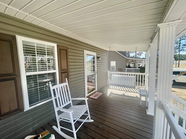 wooden deck featuring covered porch