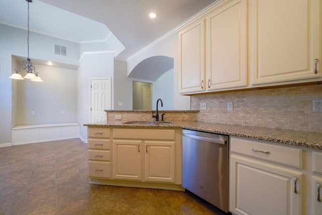 kitchen featuring visible vents, backsplash, ornamental molding, a sink, and dishwasher