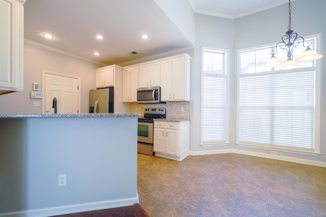 kitchen featuring stainless steel appliances, light stone countertops, white cabinets, and decorative backsplash