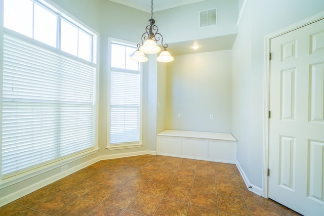 unfurnished dining area featuring a notable chandelier, crown molding, visible vents, and baseboards