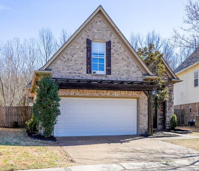 view of property exterior with a garage, fence, concrete driveway, and brick siding