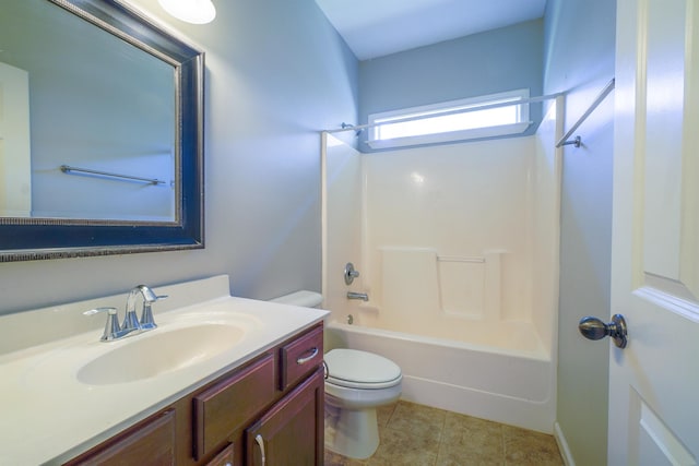 bathroom featuring toilet, tile patterned flooring, shower / washtub combination, and vanity