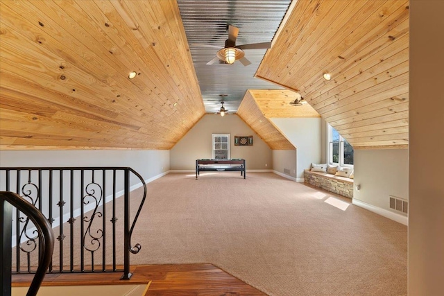 bonus room featuring wooden ceiling, carpet flooring, plenty of natural light, and baseboards