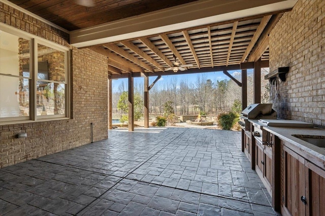 view of patio / terrace featuring an outdoor fire pit and a grill