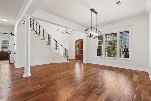 interior space featuring stairs, visible vents, dark wood finished floors, and ornamental molding