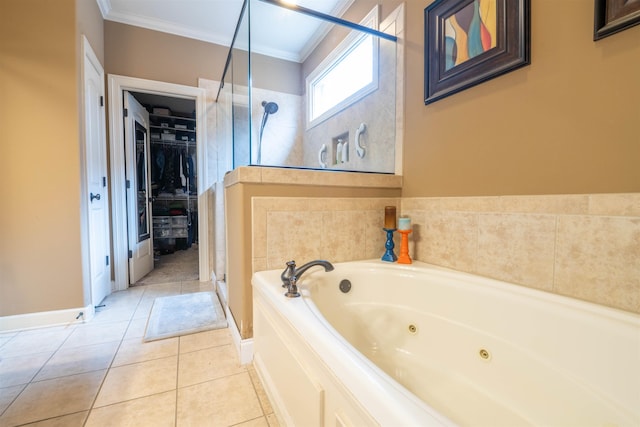 full bath with a walk in closet, ornamental molding, a shower stall, tile patterned flooring, and a tub with jets