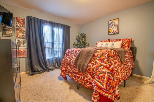 carpeted bedroom with baseboards