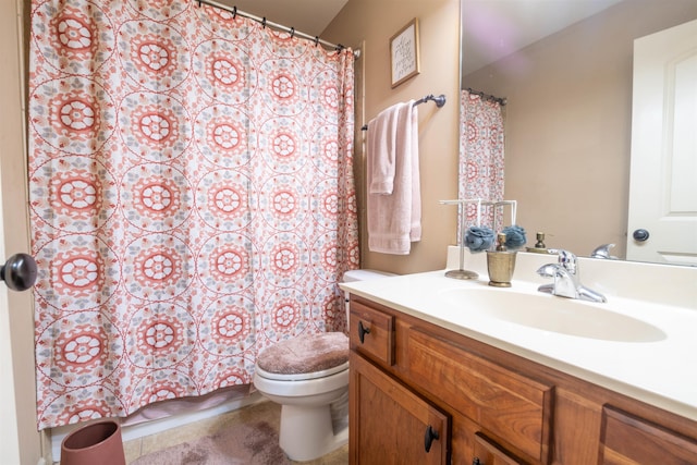 bathroom with curtained shower, vanity, and toilet