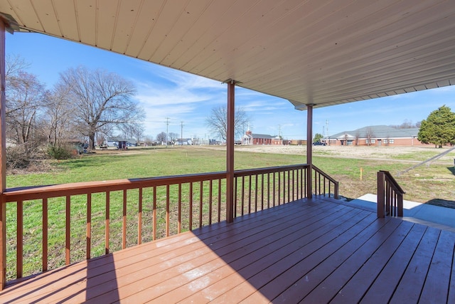 wooden deck featuring a yard