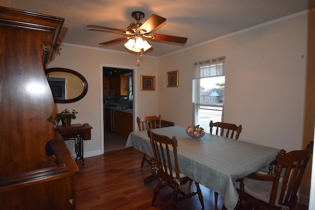 dining room with a ceiling fan, crown molding, and wood finished floors