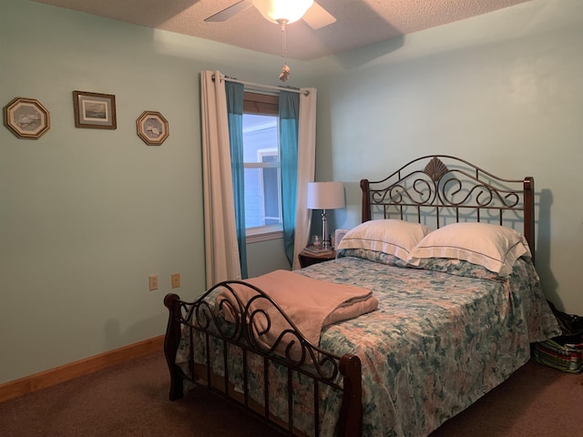 bedroom with a textured ceiling, carpet floors, a ceiling fan, and baseboards