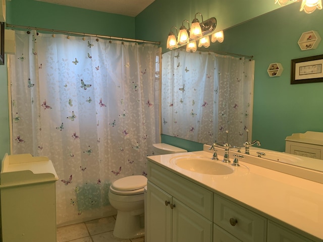 bathroom featuring toilet, curtained shower, tile patterned flooring, and vanity