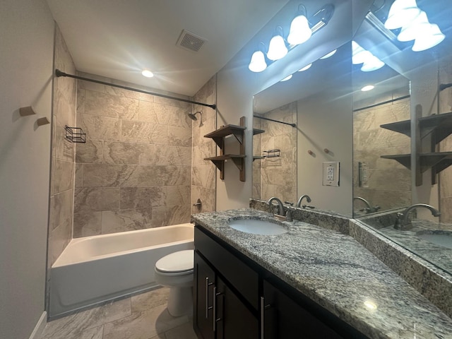 bathroom with visible vents, shower / tub combination, vanity, and toilet