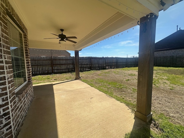 view of patio featuring a fenced backyard and ceiling fan