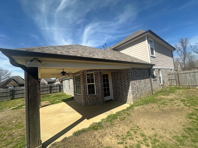 back of house with a patio area, brick siding, ceiling fan, and a fenced backyard