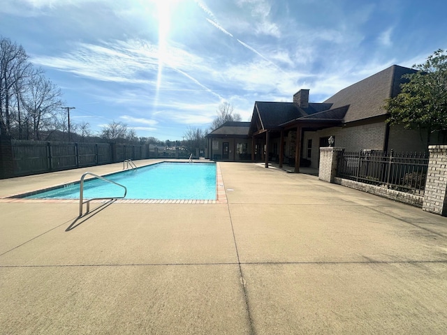 view of pool with fence, a fenced in pool, and a patio