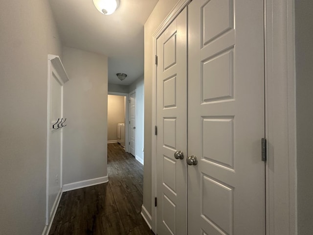 hall with baseboards and dark wood finished floors