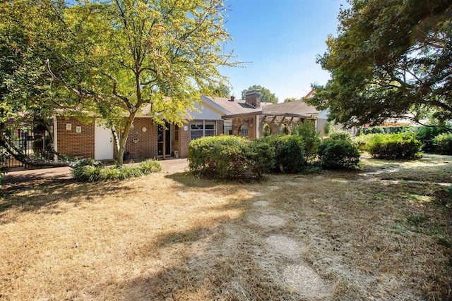 view of front of property featuring brick siding