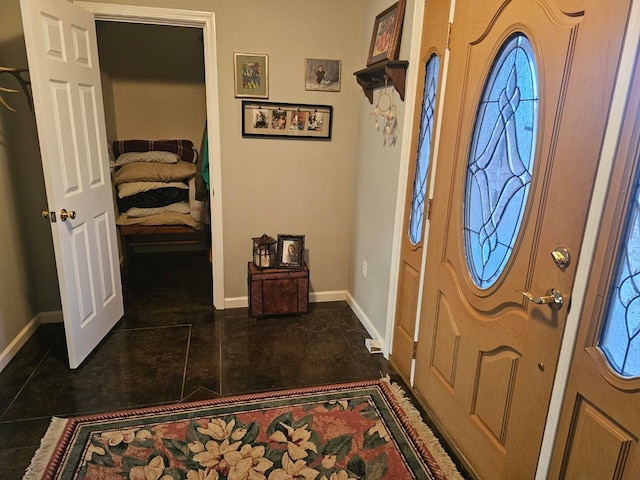 foyer entrance with baseboards