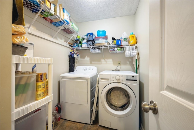 laundry area featuring a textured ceiling, laundry area, and independent washer and dryer