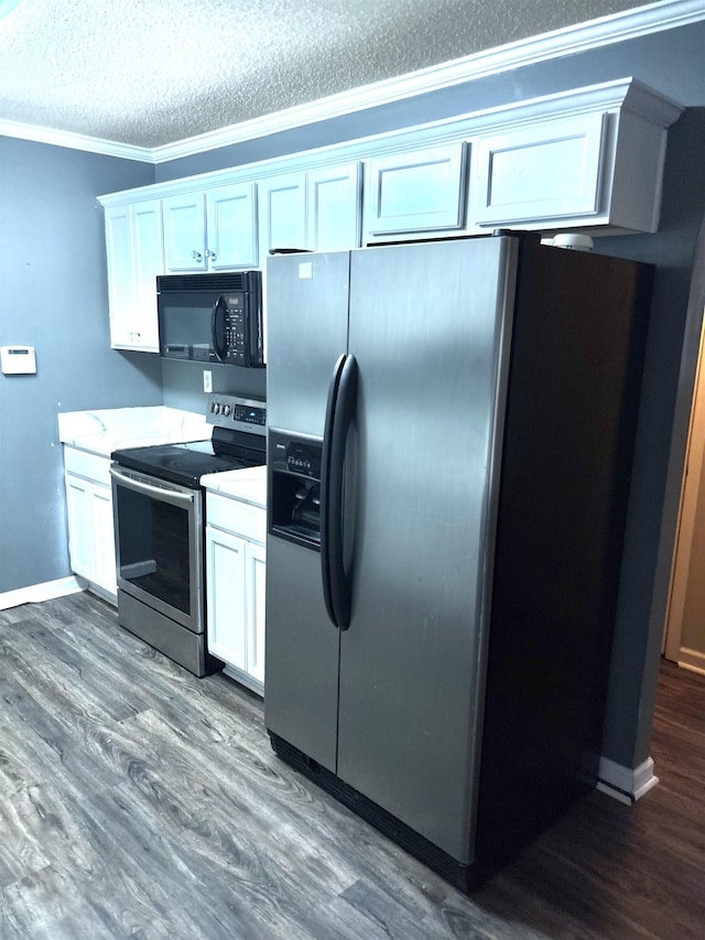 kitchen featuring white cabinets, dark wood-style flooring, stainless steel appliances, a textured ceiling, and crown molding