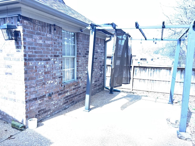 view of patio / terrace with fence and a pergola